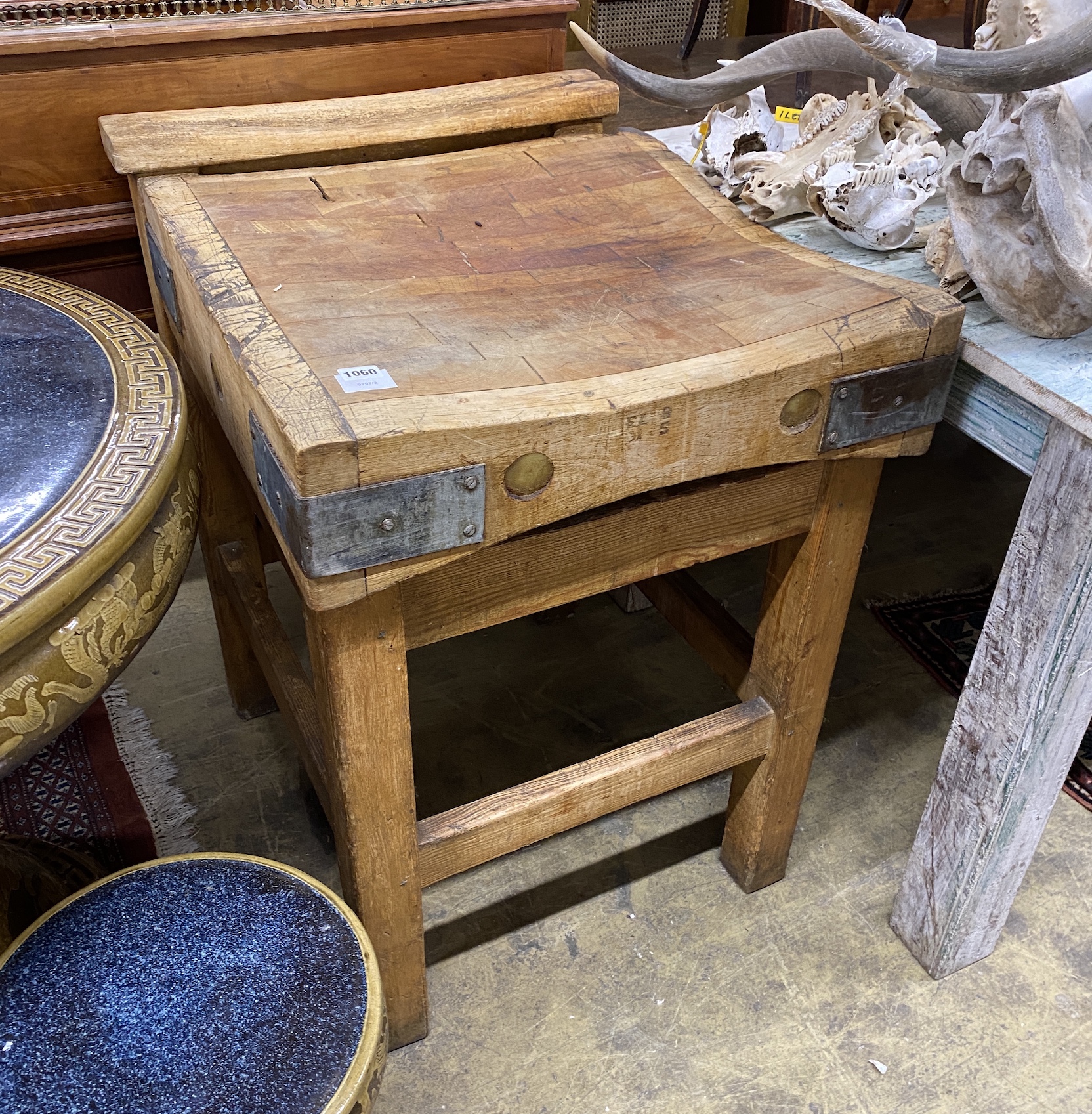 A Victorian iron bound pine butcher's block, width 61cm, depth 70cm, height 86cm